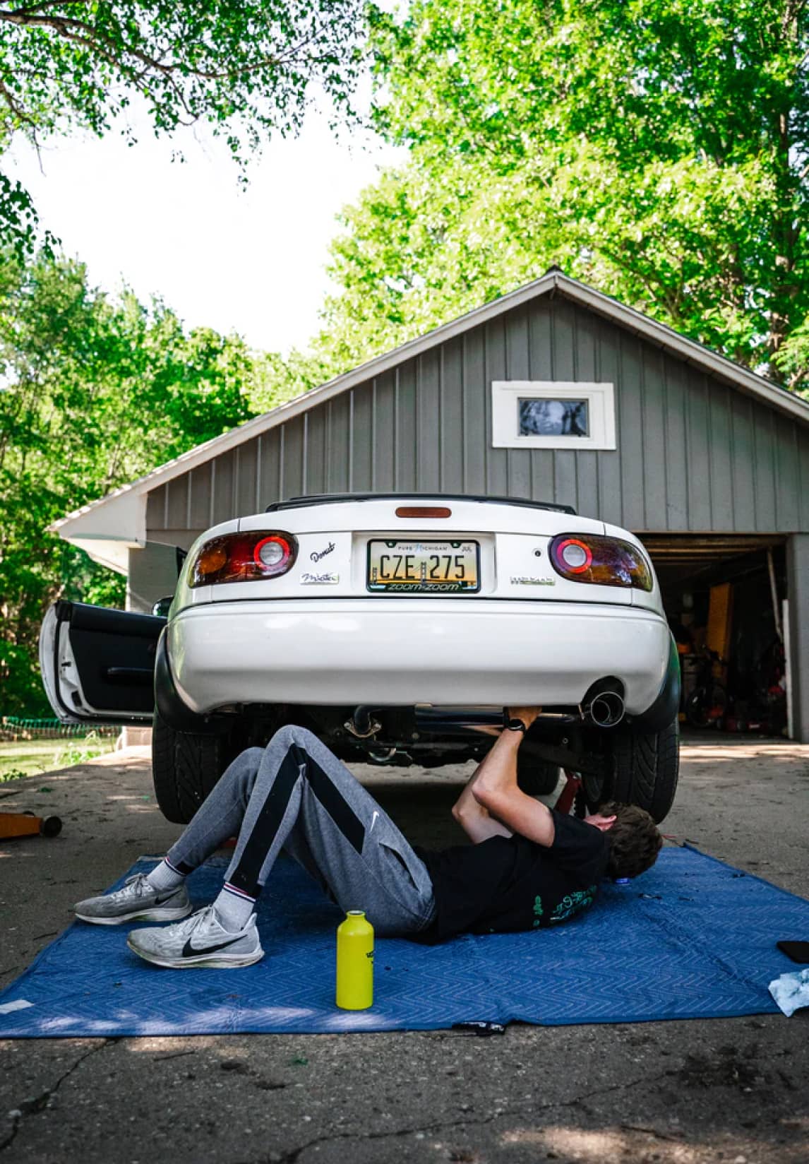 Main under a car repairing it